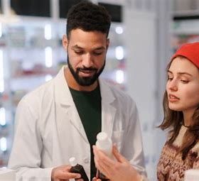 A pharmacist explaning to a patient How to Get a Legal Adderall Prescription Online