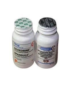 dexedrine-adhd-medication two bottles of Dexedrine tablets with a subtle medical background, representing ADHD prescription medication for focus and cognitive support.